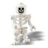 Close-up of a white LEGO skeleton minifigure with a smiling skull face and movable arms and legs, included as part of the Halloween Barn building set for spooky seasonal play.