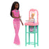 Barbie Baby Doctor doll with medical tools stands next to baby doll lying in pink crib station with teal legs, showcasing pediatric play accessories for interactive storytelling.