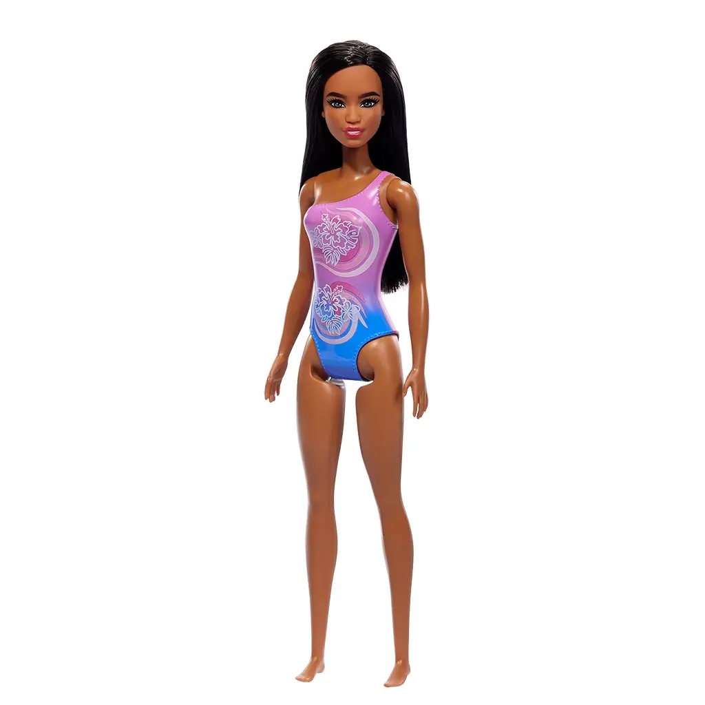 Barbie beach doll angled view, highlighting her long dark hair and gradient purple swimsuit with tropical hibiscus prints, giving a stylish beach-ready appearance.