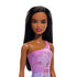 Close-up of Barbie beach doll with smooth dark brown hair, bright red lips, and a purple one-shoulder swimsuit decorated with detailed hibiscus floral graphics.