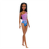 Barbie doll shown full-length with sleek dark hair, wearing a tropical purple one-shoulder swimsuit with hibiscus details, posed against a plain white background.