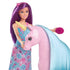 Barbie doll with purple hair and patterned dress brushes the pink unicorn toy’s long blue mane, highlighting the playset’s hair styling and interactive storytelling features.