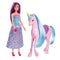 Barbie doll with long purple hair wearing a floral dress stands beside a glossy pink unicorn toy with blue mane and yellow horn, perfect for magical pretend play adventures.