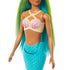Close-up of Barbie mermaid doll’s outfit featuring a yellow and white seashell-inspired top with pearl details, paired with a sculpted turquoise mermaid tail.
