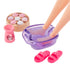 Barbie spa set accessories including purple foot bath, pink sandals, rose-shaped bath bombs, and small pink aromatherapy holder for doll play.