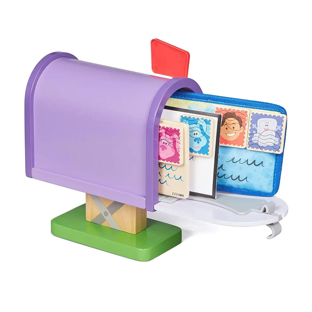Melissa & Doug Blue’s Clues & You! wooden mailbox play set shown with letters and envelopes inside, featuring colorful character stamps that help kids learn sequencing, sharing, and role-play fun.