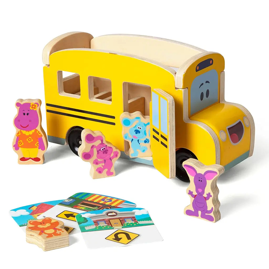 Melissa & Doug Blue’s Clues & You! wooden pull-back school bus toy with Blue, Magenta, and friends, including wooden destination cards for imaginative travel and character-based storytelling.