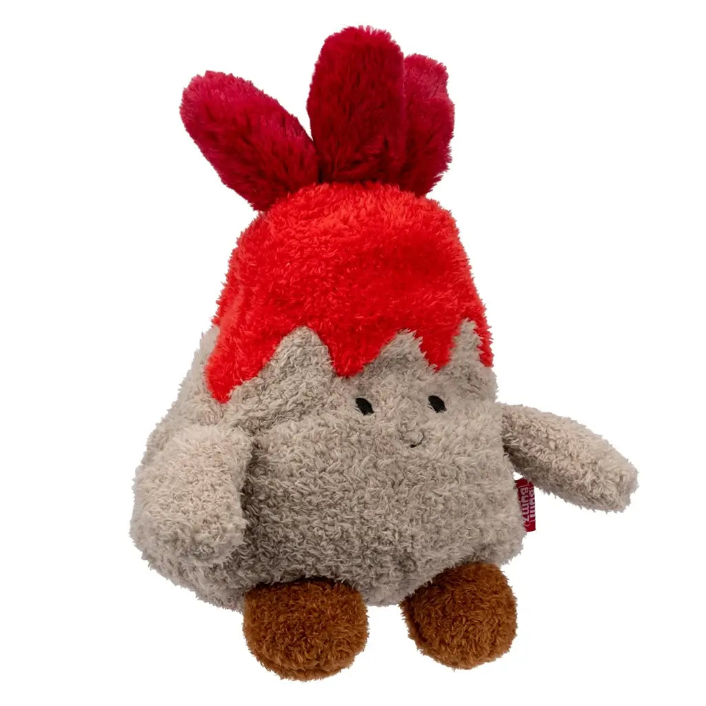 Angled side view of Bum Bumz WeatherBumz Volkan the Volcano plush featuring fluffy gray body, red lava top with soft flame tufts, round brown feet, and a tiny stitched smile, placed on a plain white backdrop.