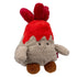 Angled side view of Bum Bumz WeatherBumz Volkan the Volcano plush featuring fluffy gray body, red lava top with soft flame tufts, round brown feet, and a tiny stitched smile, placed on a plain white backdrop.