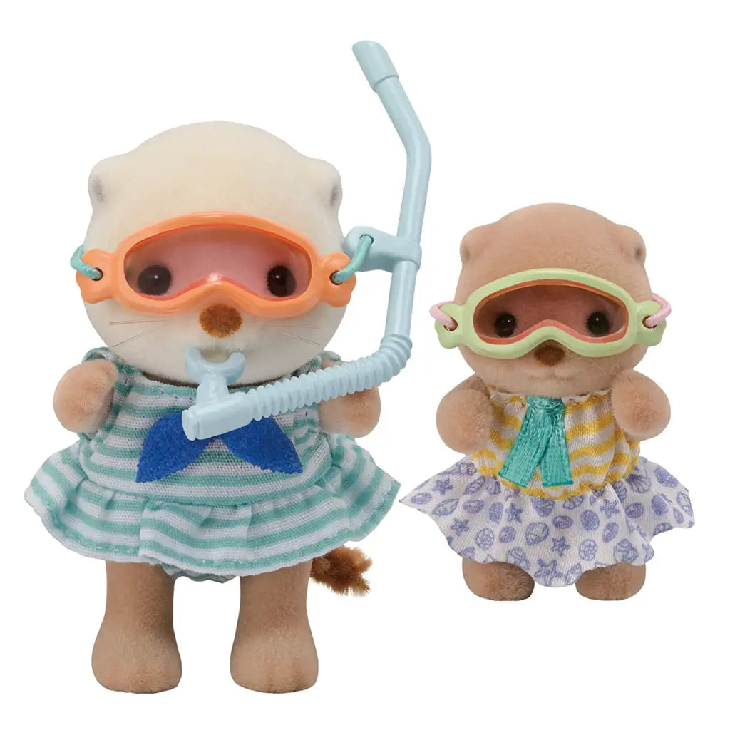 Calico Critters Sea Otter Sisters dolls in striped and patterned dresses, wearing colorful snorkel masks with a snorkel tube, posed against a plain white background for toy display.