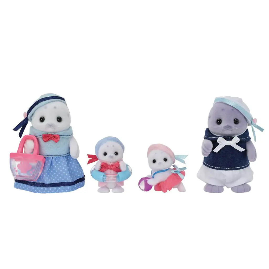 Full set of Calico Critters Seal Family plush figures standing upright against white background, dressed in matching blue and pink fabric outfits with included toy accessories.