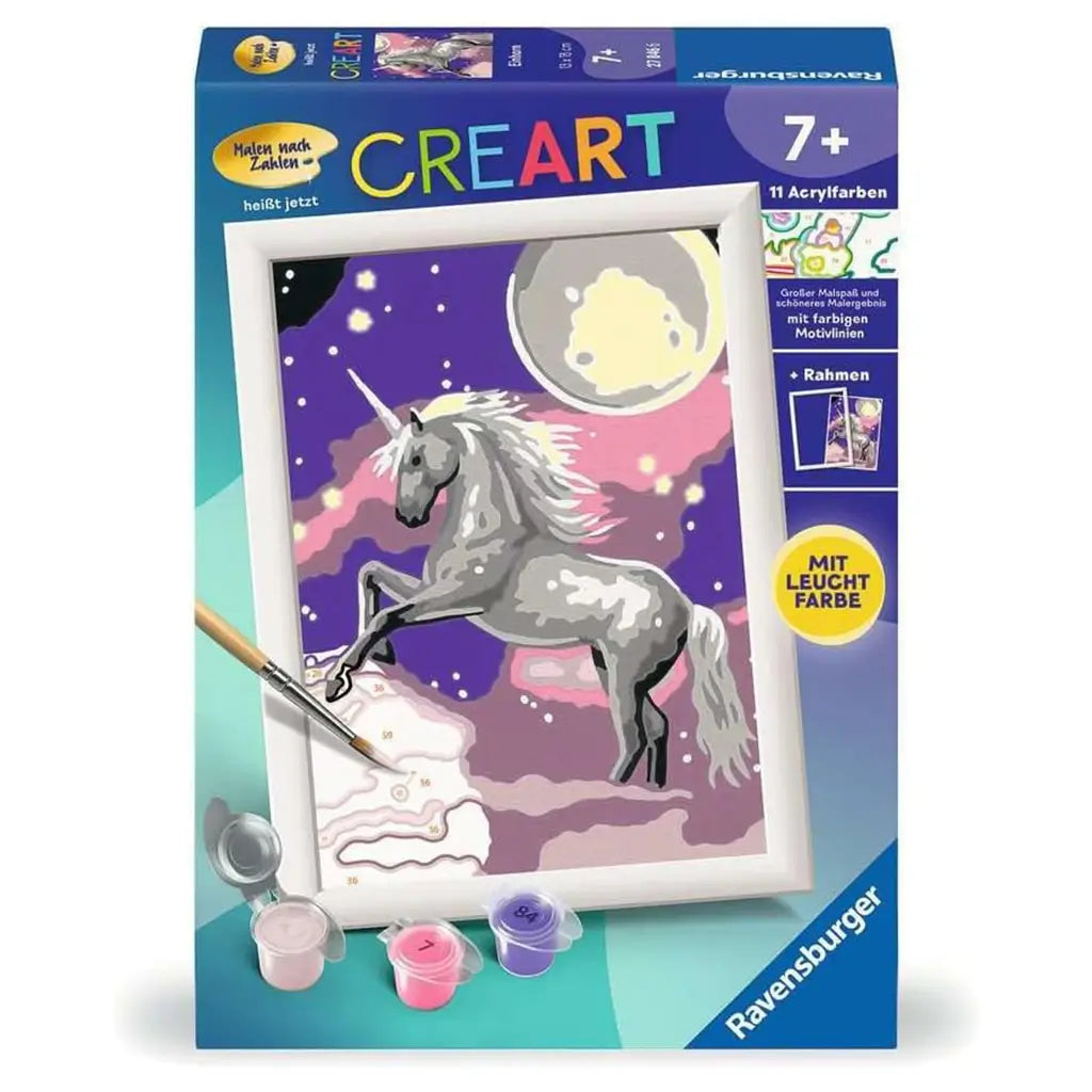 Front of Ravensburger CreArt paint-by-numbers kit for kids age 7+, featuring a glowing unicorn under a moonlit sky with included paints and brush.