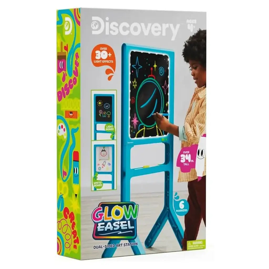 Discovery Glow Easel retail box featuring product image, child using the glowing art board, and text promoting 30+ light effects and dual-sided design for ages 4 and up.