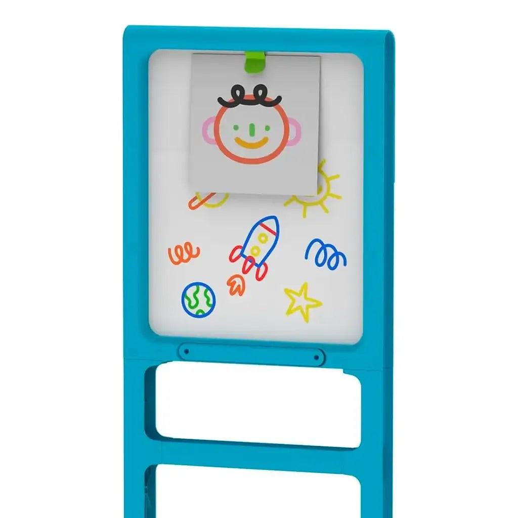 Discovery Glow Easel’s whiteboard side featuring colorful marker drawings of a rocket, planet, sun, and smiley face, demonstrating its non-glow drawing function for creative play.