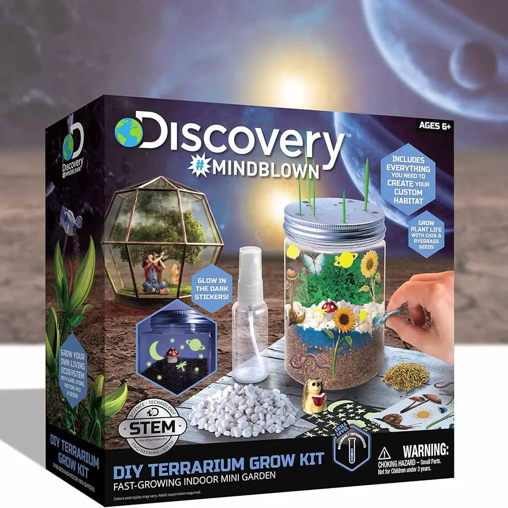 Discovery Mindblown DIY Terrarium Grow Kit box showing a glowing mini garden in a clear jar with plants, butterflies, stickers, and a spray bottle, designed for STEM learning for ages 6 and up.