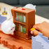 Close-up of Hot Wheels Mario Kart Boo’s Spooky Sprint haunted library with Boo ghost figures and spinning brown bookshelf obstacle operated by a child’s hand crank.