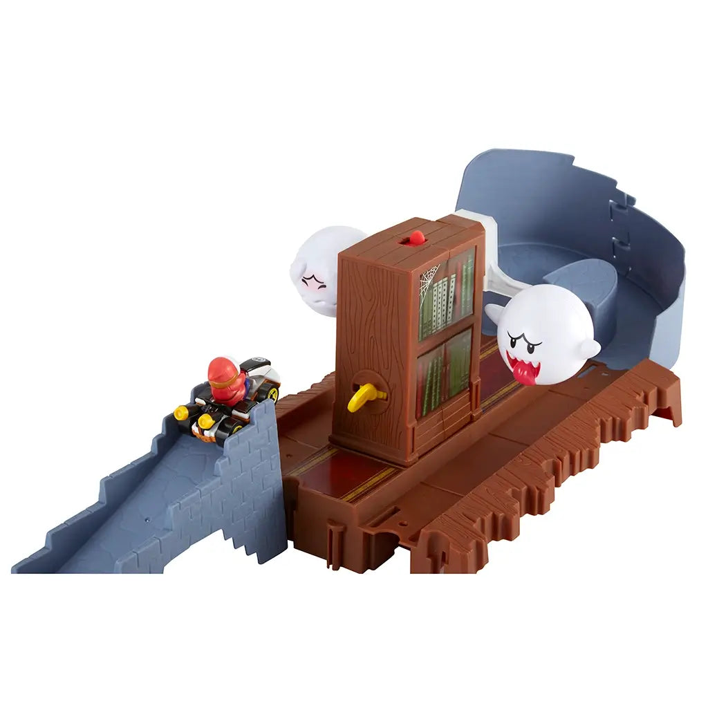 Hot Wheels Mario Kart Boo’s Spooky Sprint playset with Shy Guy racing kart approaches haunted library track while two Boo ghost figures loom beside rotating bookshelf.