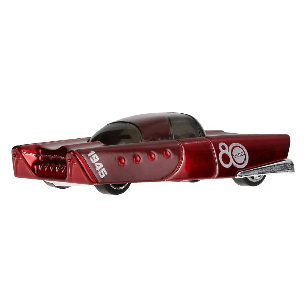 Angled rear view of Hot Wheels Mattel Dream Mobile toy car in metallic red with chrome details and 1945 printed on the tail fin, celebrating Mattel’s legacy.
