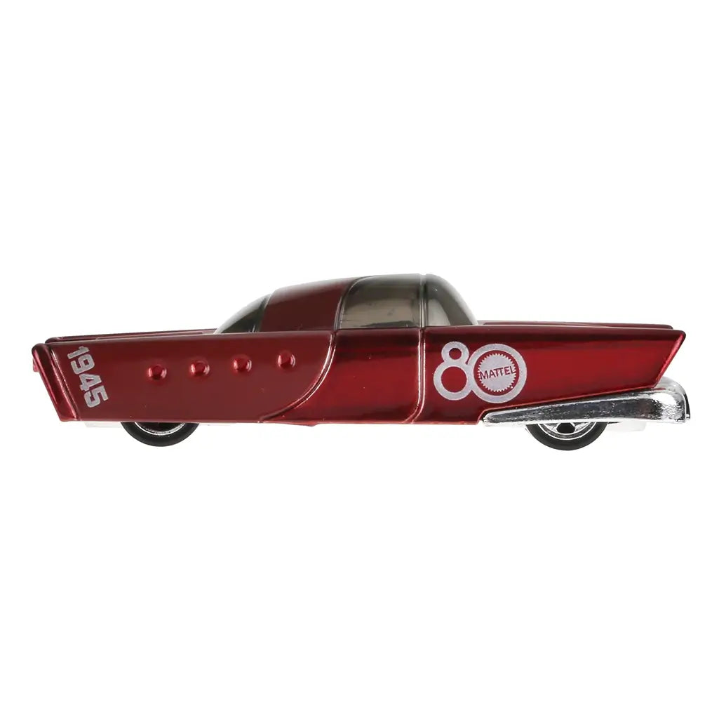 Side profile of Hot Wheels Mattel Dream Mobile 1:64 scale toy car in glossy red with silver trim, 1945 and 80th anniversary logo displayed prominently.