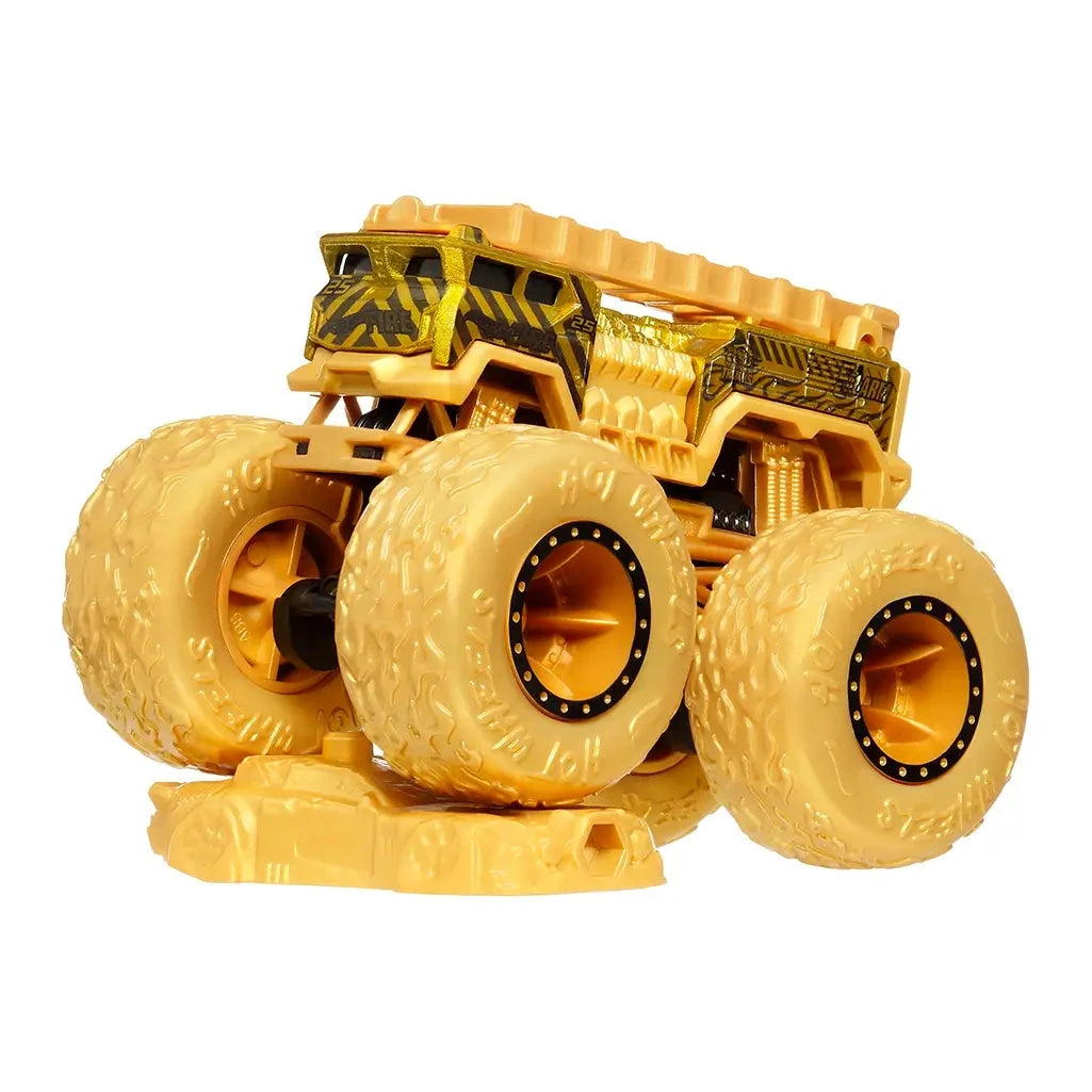 Hot Wheels gold 5 Alarm monster truck crushing a gold car accessory, designed for rugged off-road-style monster truck pretend play.