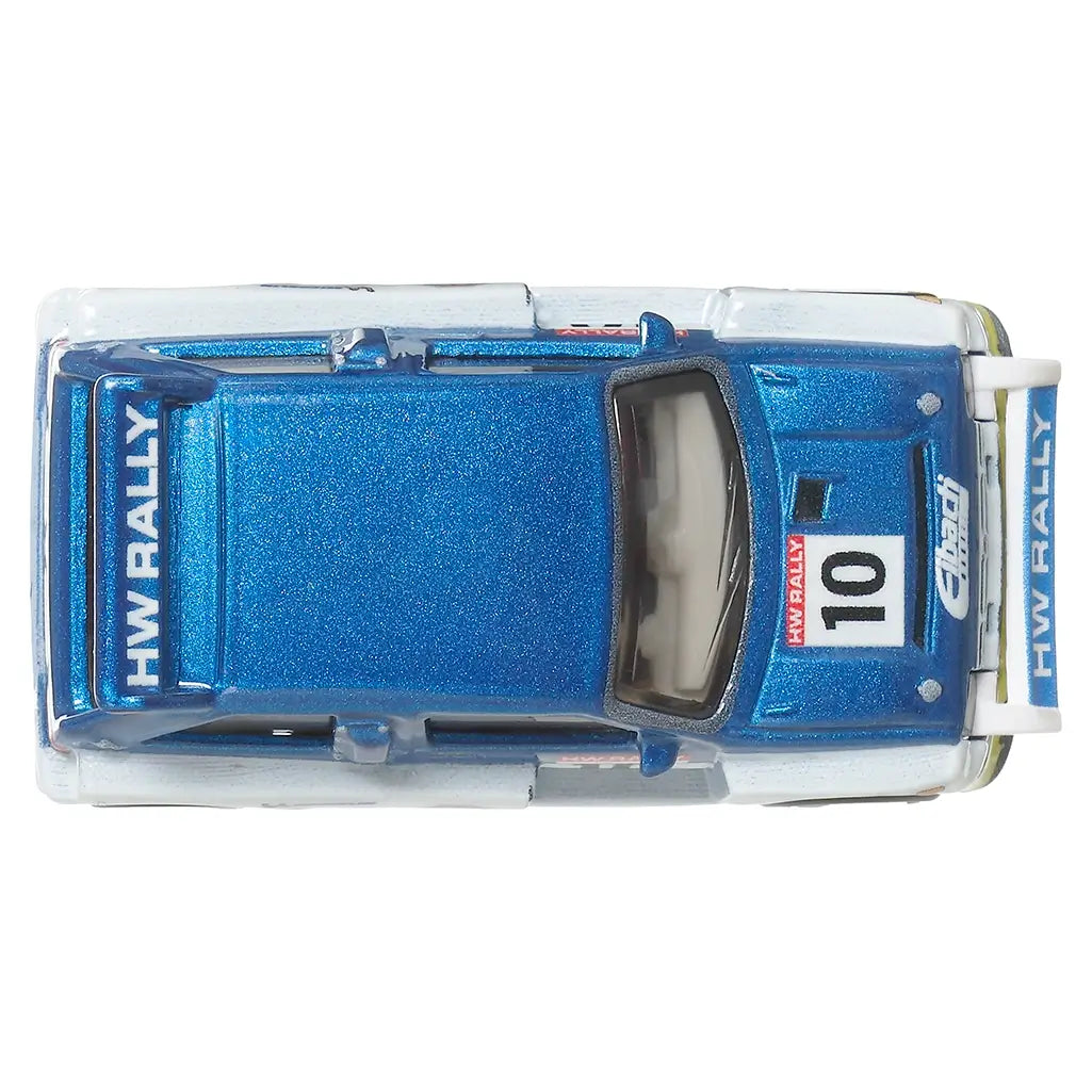 Top-down view of Hot Wheels MG Metro 6R4 Premium die-cast car in metallic blue, showing roof and hood rally decals and HW RALLY branding.