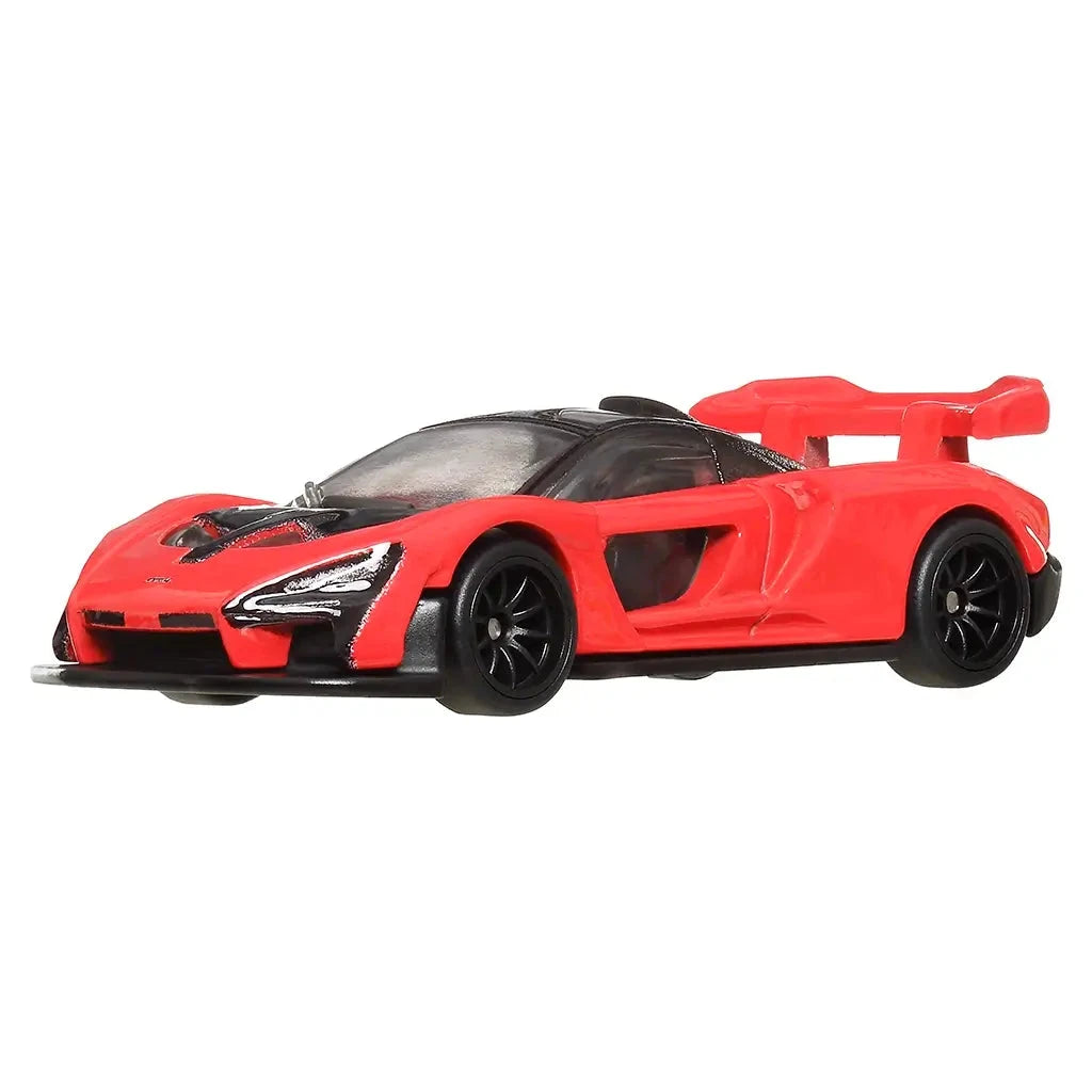 Front angled view of Hot Wheels McLaren Senna 1:64 model in red with black hood and aerodynamic body design.