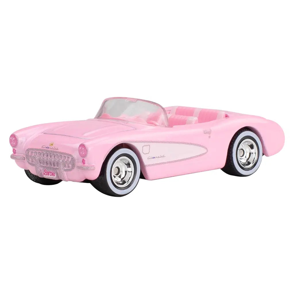 Pink diecast Hot Wheels 1956 Chevrolet Corvette convertible with white interior, glitter accents, and Barbie license plate from Barbie The Movie Pop Culture series.
