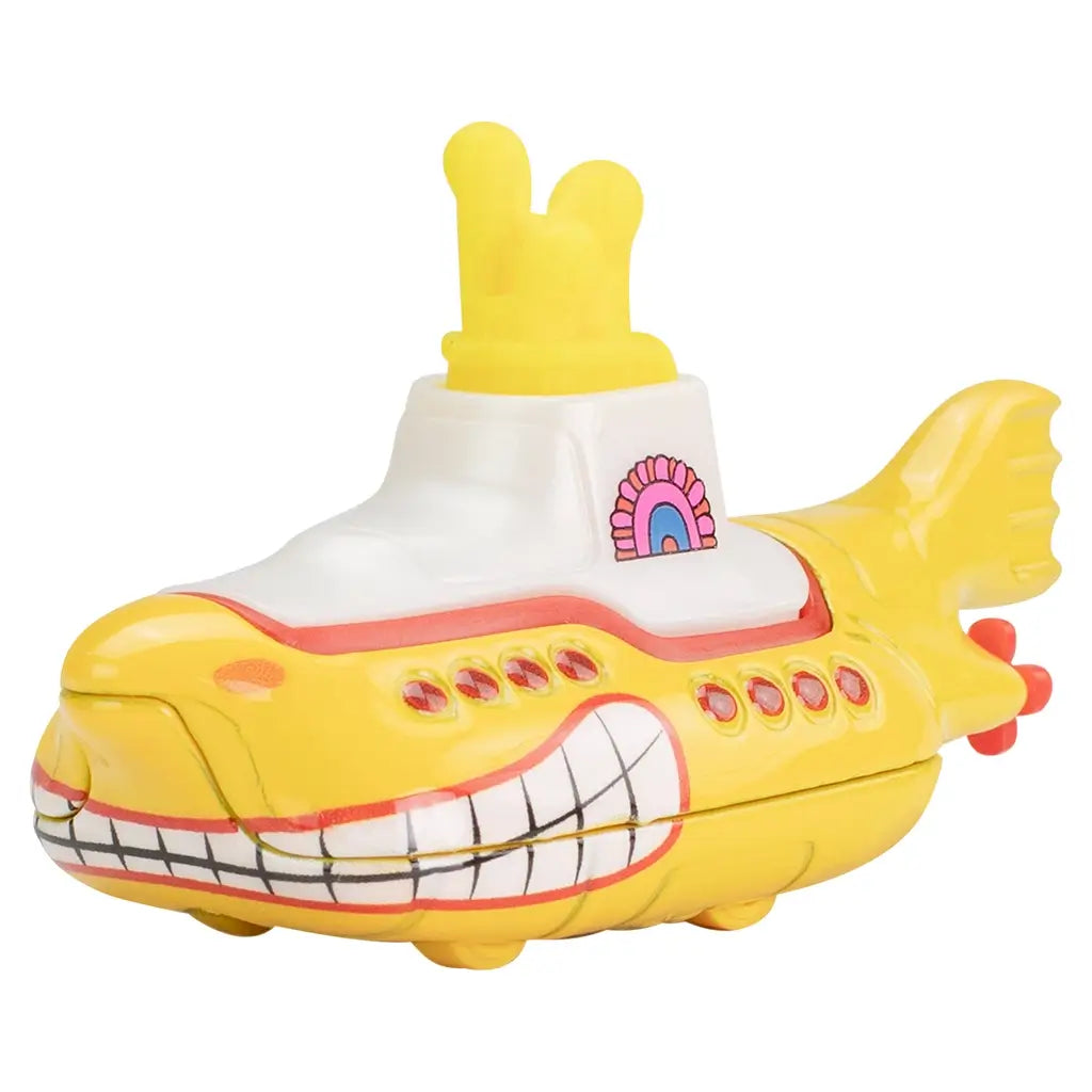 Front view of Hot Wheels Beatles Yellow Submarine toy, showing curved yellow hull, white conning tower with red trim, red portholes, and detailed smiling bow artwork.
