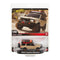 Hot Wheels Premium 2000 Toyota 4Runner diecast SUV in tan with roof gear, spare tire, and rugged details, packaged in 1:43 scale display card featuring off-road desert backdrop.