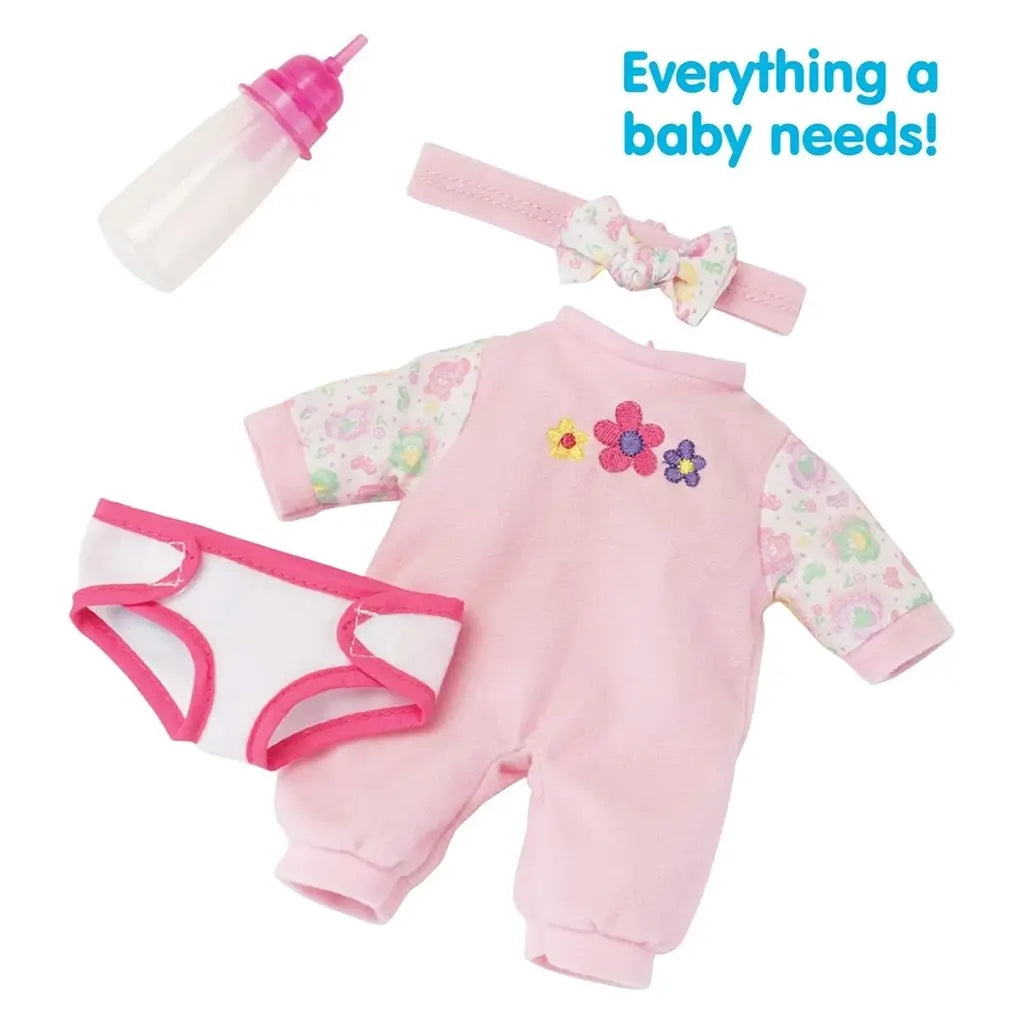 Sweetie Doll accessories include a pink floral sleeper outfit, diaper, matching bow headband, and pink baby bottle, displayed neatly with text reading 