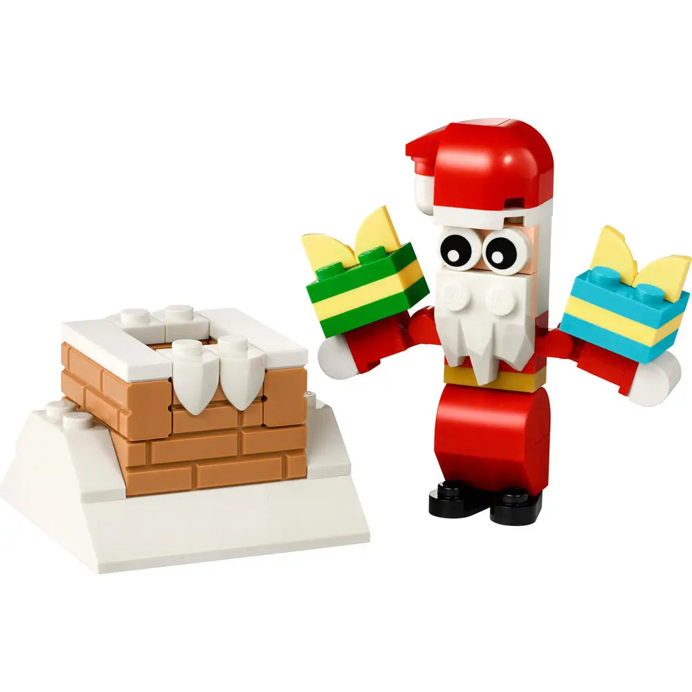 LEGO Creator Christmas set featuring a red and white Santa Claus figure holding two colorful presents beside a snow-covered brick chimney, built from interlocking plastic blocks.