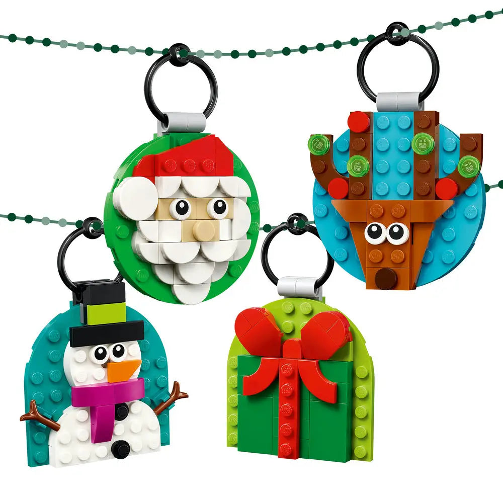 LEGO Christmas ornaments hanging on a string, including Santa, a reindeer, a snowman, and a green present with a red bow.
