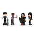LEGO Wednesday Morticia’s Cottage set minifigures including Wednesday Addams, Morticia Addams, Enid Sinclair, and Lurch, each holding themed accessories like books, umbrellas, and a checklist.