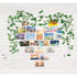 Wall collage of colorful photo cards with faux ivy string lights arranged in a heart shape, creating a cozy, illuminated decor setup on a white brick background.