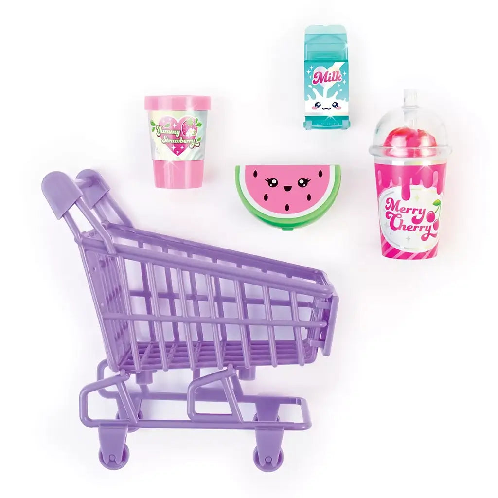 Overhead view of 3C4G Tiny Treats Trolley Lip Gloss Set featuring a lavender cart and dessert-themed lip gloss containers arranged neatly on a white background.