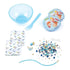 Rice Krispies DIY Bracelet Kit contents including blue bowl, spoon, dissolvable pouches, assorted blue and gold beads, string, and enamel charms shaped like cereal and milk.