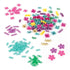 Bright assortment of Linxo bracelet kit components, including shiny teal, gold, purple, and pink flower-shaped and link pieces, displayed on a white surface for easy jewelry creation.