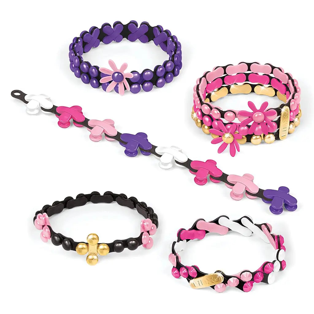 Colorful Linxo Popstar Chic Jewelry Design Set featuring five handmade elastic bracelets in pink, purple, black, white, and gold tones, accented with flower-shaped charms and metallic bead details on a white background.