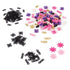 Linxo bracelet-making kit components spread on a white surface, including black connectors, pink and purple beads, golden charms, and flower accents for customizable jewelry designs.