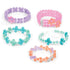 Linxo Seaside Style Jewelry Design Set featuring five handmade bracelets in pastel blue, pink, orange, and lavender tones with floral accents and flexible connectors.