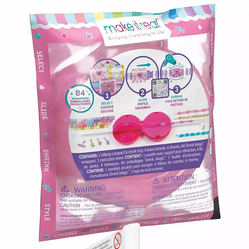 Detailed back view of Make It Real Shrink Magic green packaging highlighting shrink tray tools, wrappers, charms, and included materials.