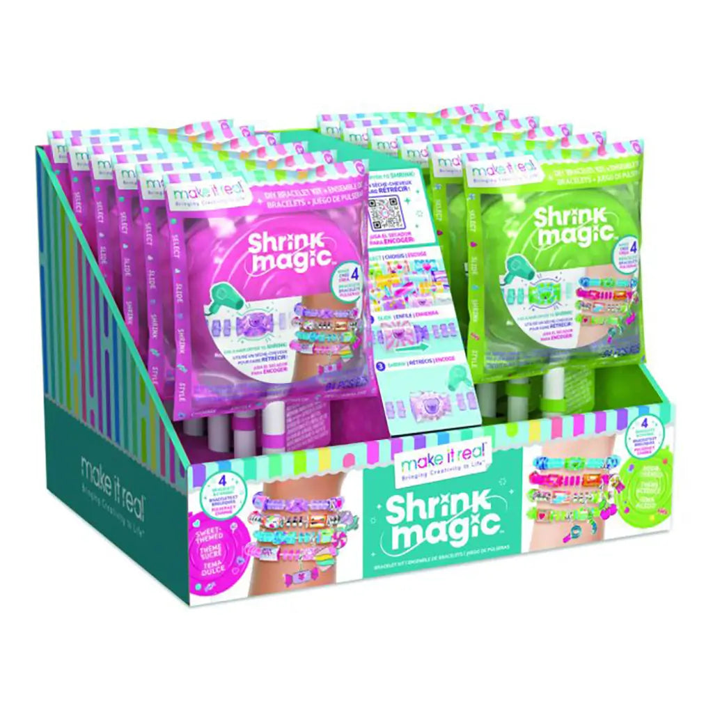 Retail display of Make It Real Shrink Magic DIY Bracelet Kits in colorful packaging, showing both pink and green lollipop-style sets for creative bracelet crafting.