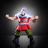 Ram Man Masters of the Universe action figure with muscular build, silver armor, and red tunic, standing ready for battle with arms flexed on black reflective surface.