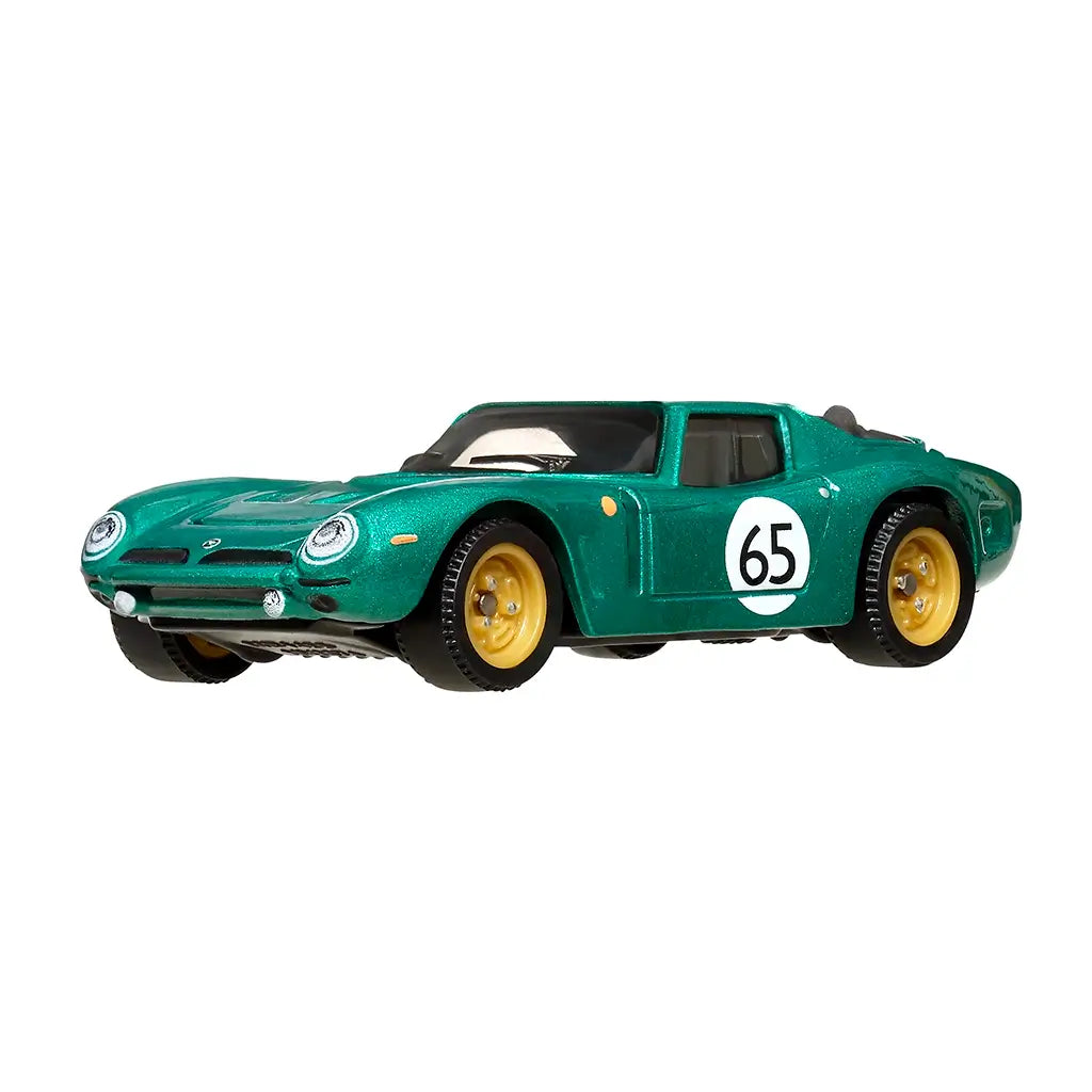 Die-cast Matchbox Bizzarrini 5300 GT Corsa Revival model in metallic green, featuring sleek curves, gold wheels, front headlights, and bold number 65 racing livery on doors.