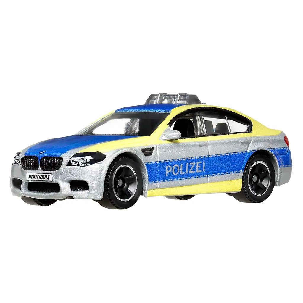 Matchbox BMW M5 Police toy car in 1:64 scale, silver body with blue hood, yellow trim, black wheels, and Polizei markings, displayed on plain white background.