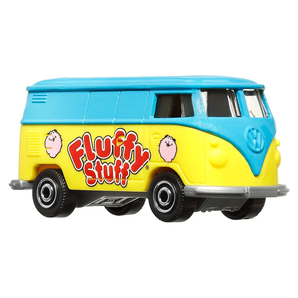 Miniature Matchbox Volkswagen delivery van toy in yellow and blue with “Fluffy Stuff” cotton candy graphics, silver bumpers, and black wheels, displayed at front angled view.