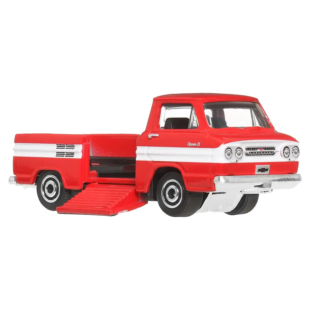 Side view of Matchbox diecast 1961 Chevy Corvair Rampside Pickup in red with white side stripe, chrome bumper accents, and rolling black wheels designed for realistic play.