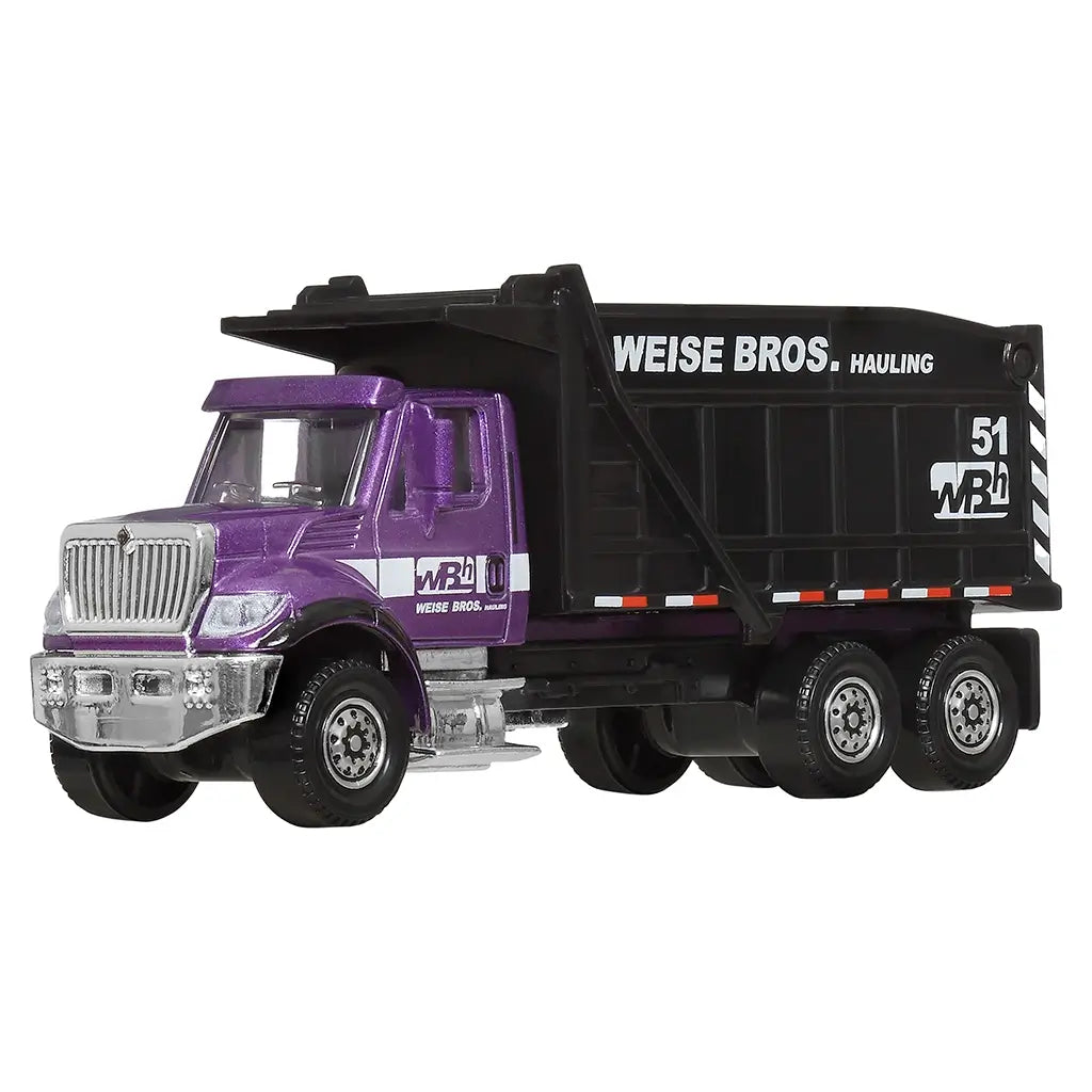 Matchbox International WorkStar 7500 Dump Truck diecast in purple and black Weise Bros. Hauling livery, detailed chrome grille, and black dump bed shown in angled view.