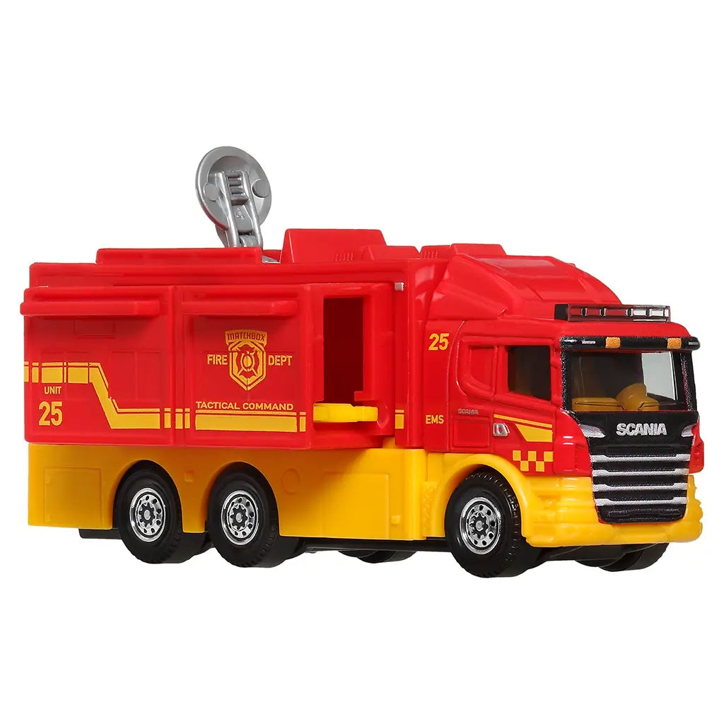 Bright red and yellow Matchbox Scania Tactical Command Center fire truck toy with six wheels, fire department insignia, and movable parts for realistic emergency play scenes.