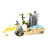 Mega Construx Pokémon set showing a tan and gray rocky battle arena with green plant details and transparent fire and water attack effects for imaginative play.
